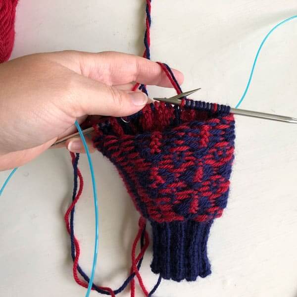 Working stranded knitting in the round from the wrong side.