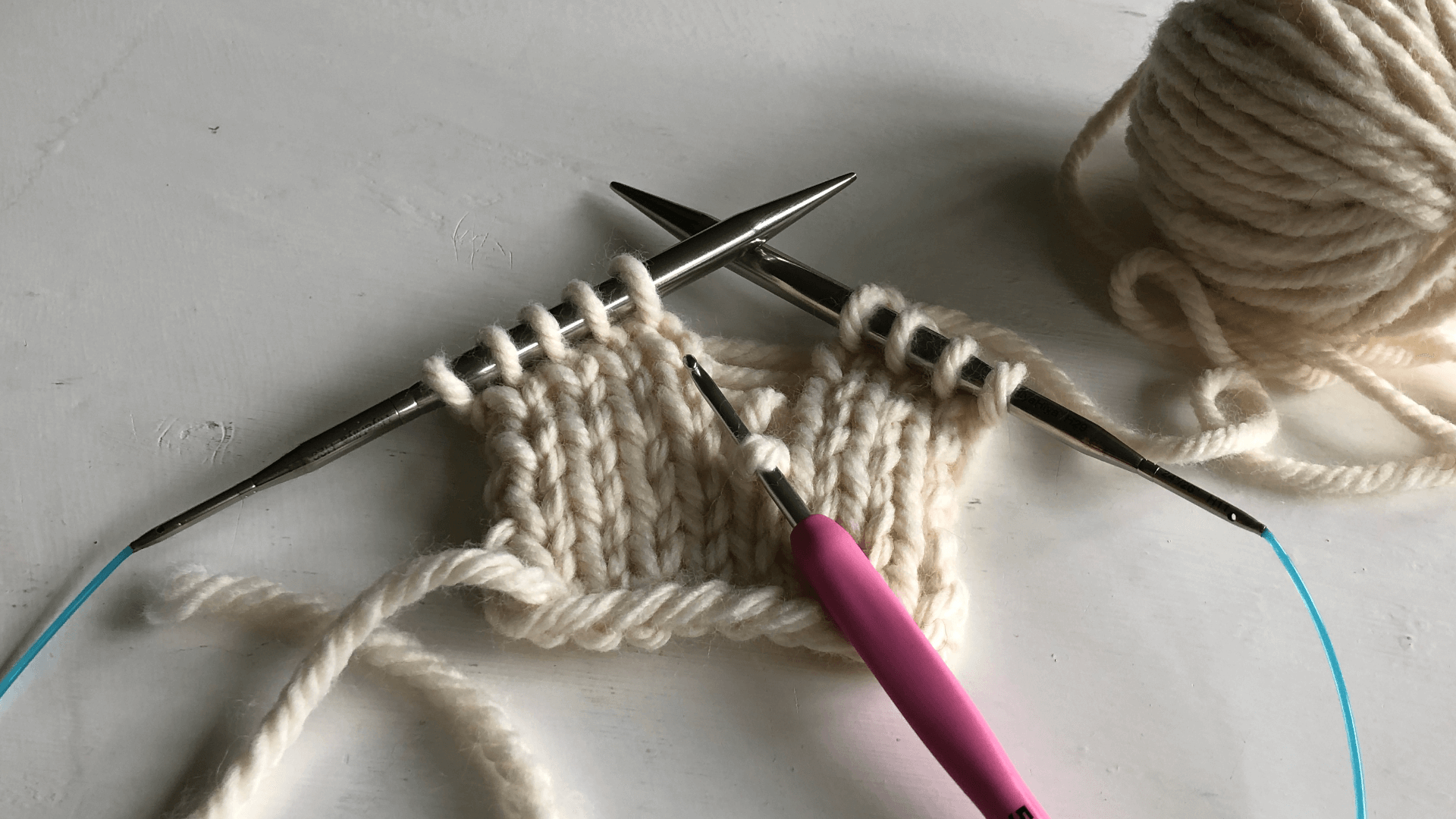Start with catching the dropped stitch with your hook