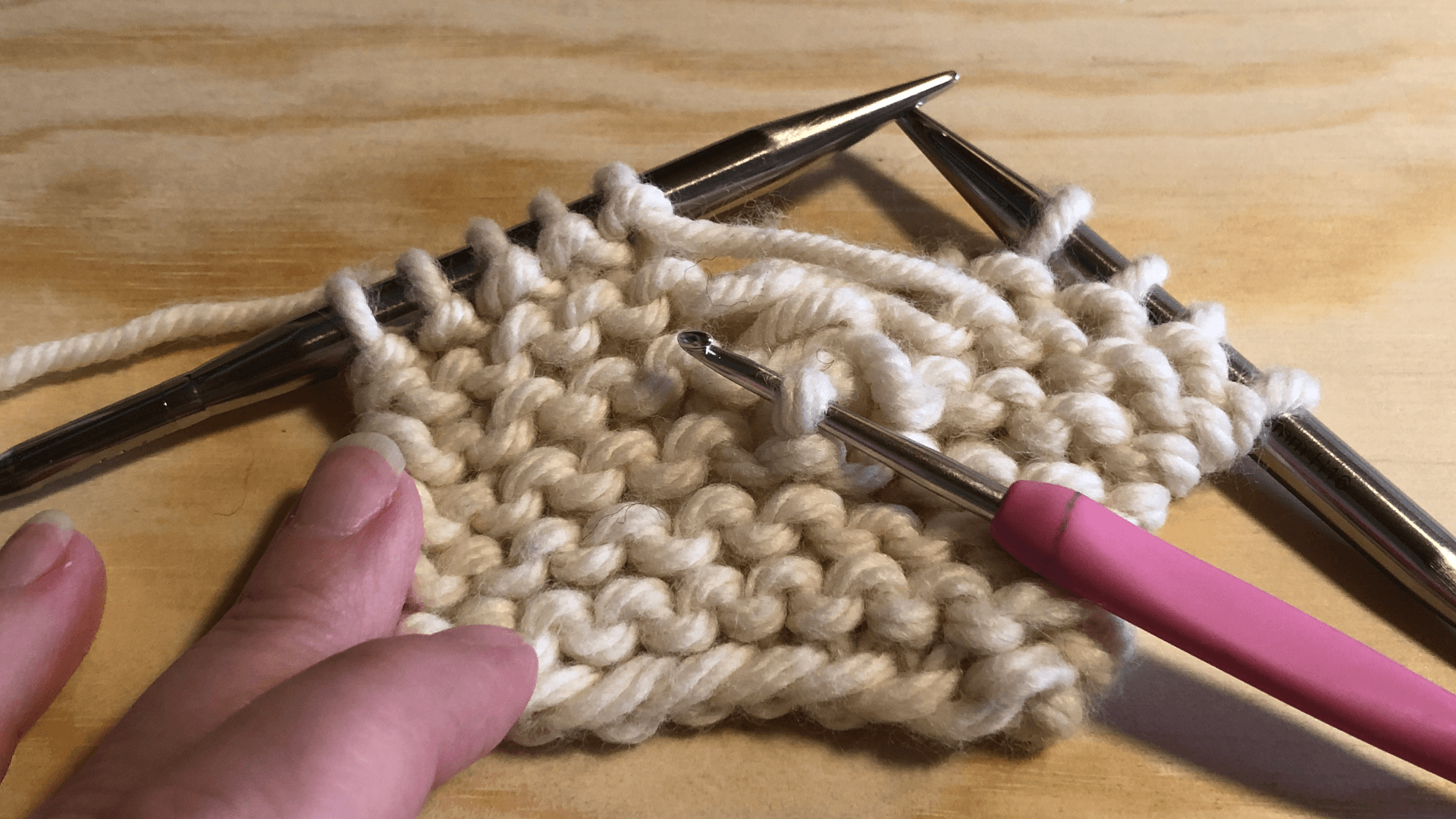 Step 1 is to look for the purl bump and insert your crochet hook from that side. 